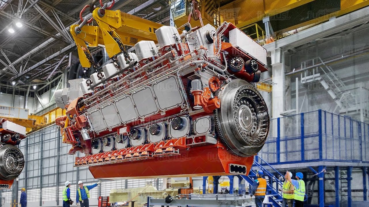 maxresdefault A Gigantic commercial ship engine suspended on mechanical arms during engine repair and building
